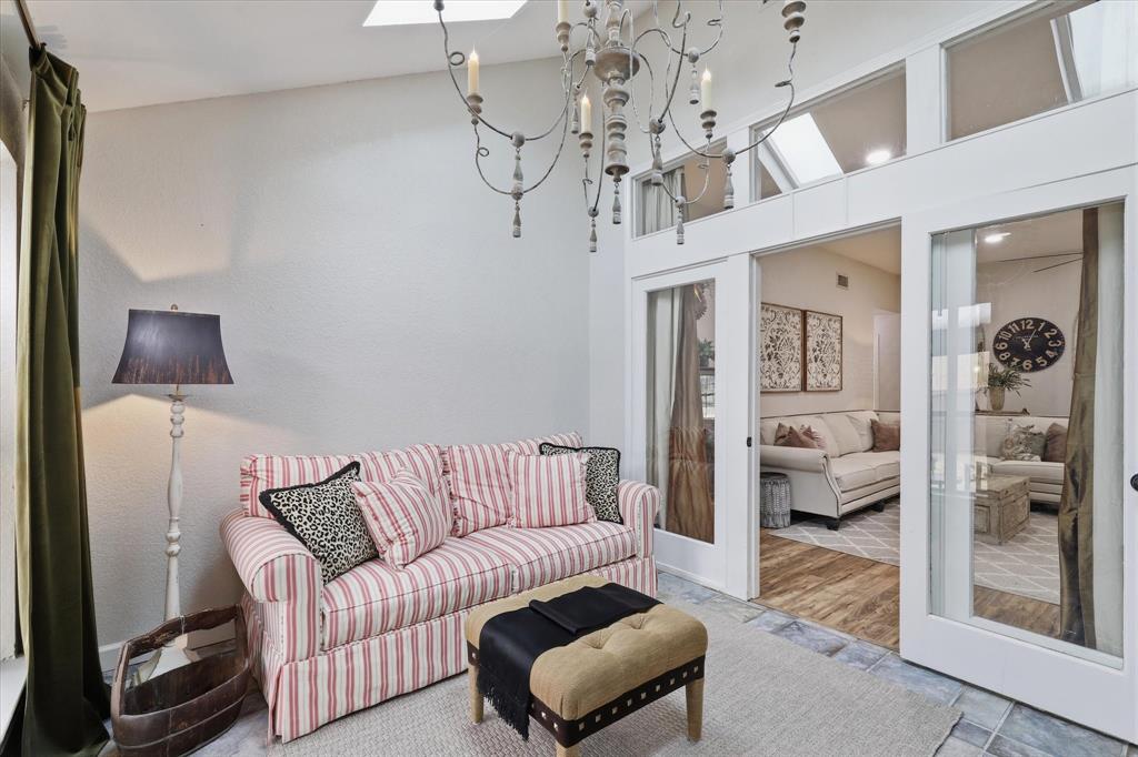 Light-filled flex space connects to the main living area and offers views of the backyard.