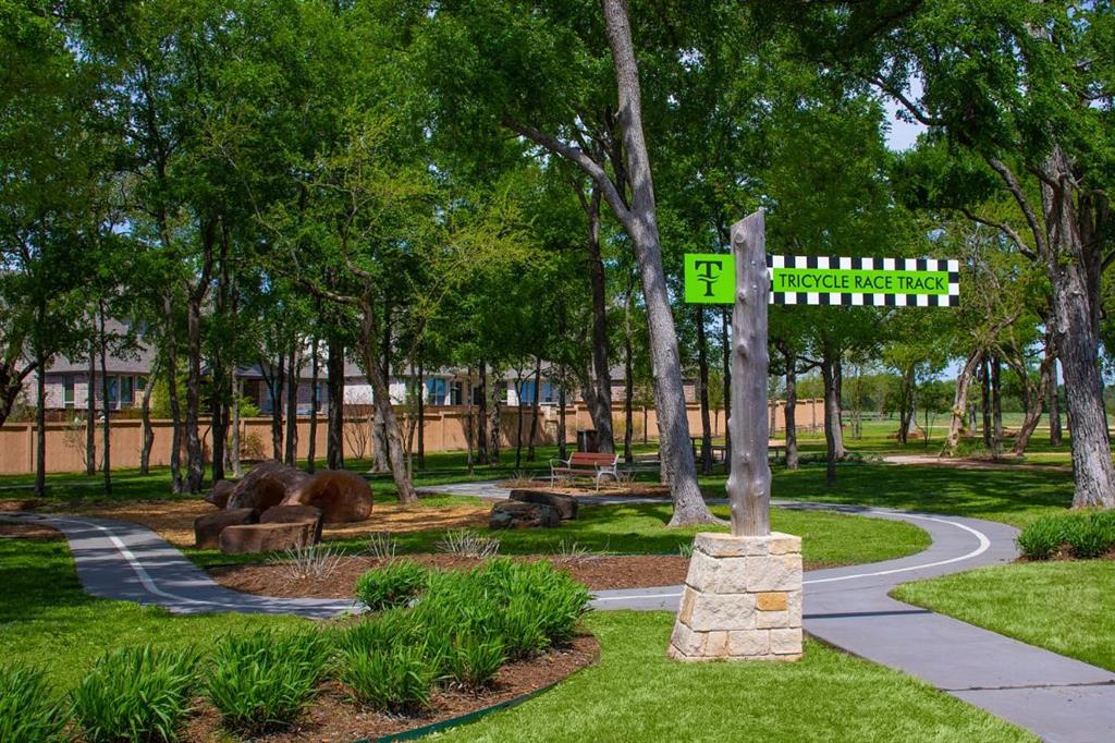 Trinity Falls photo from their website showing one of the many amenities, trails, pools, gym and parks in the community.