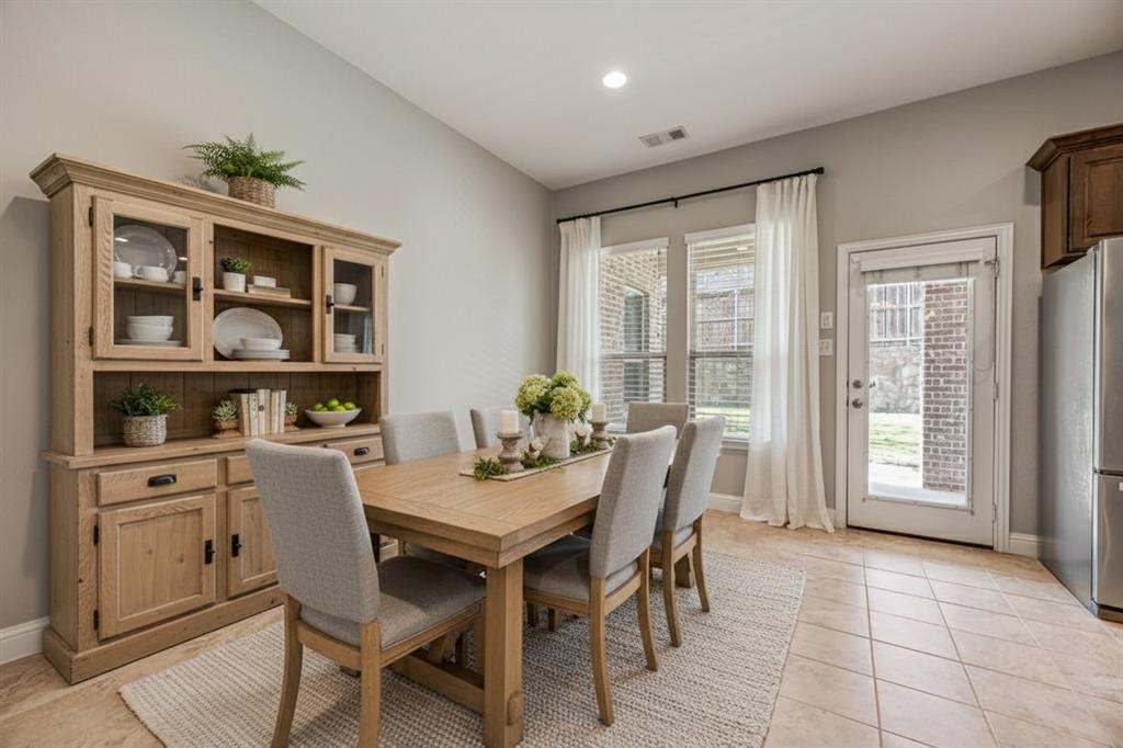 Dining room has been virtually staged to showcase potential décor and layout options.