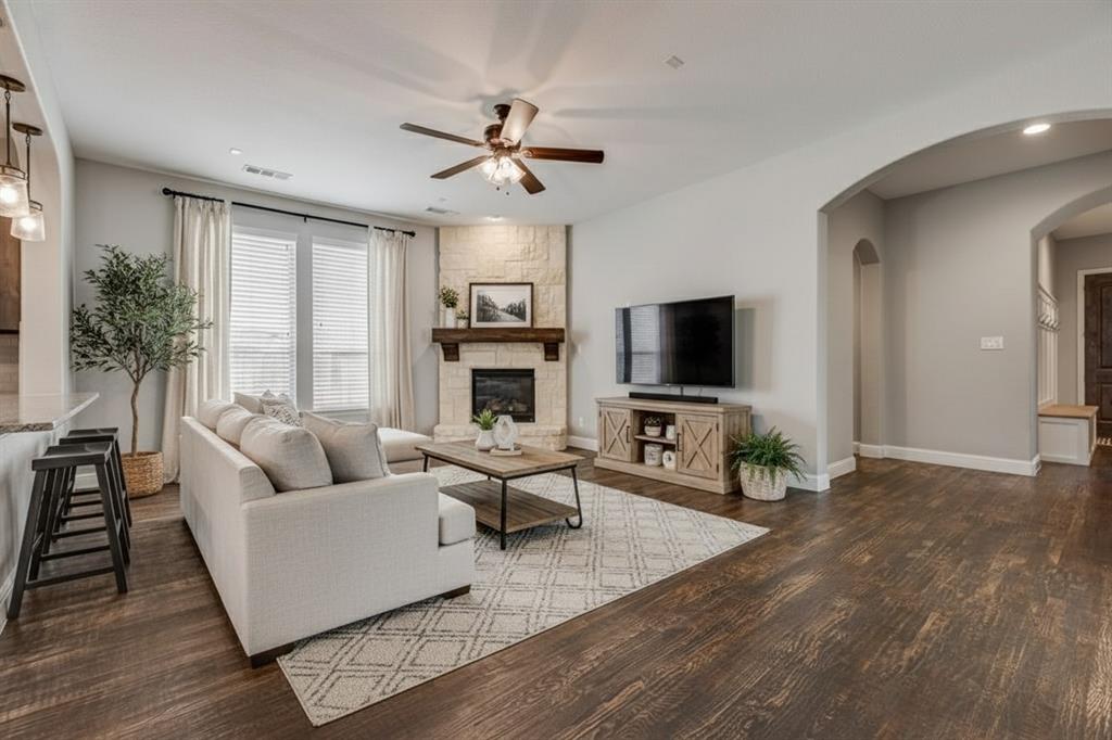 The living room has been virtually staged to showcase potential décor and layout options.