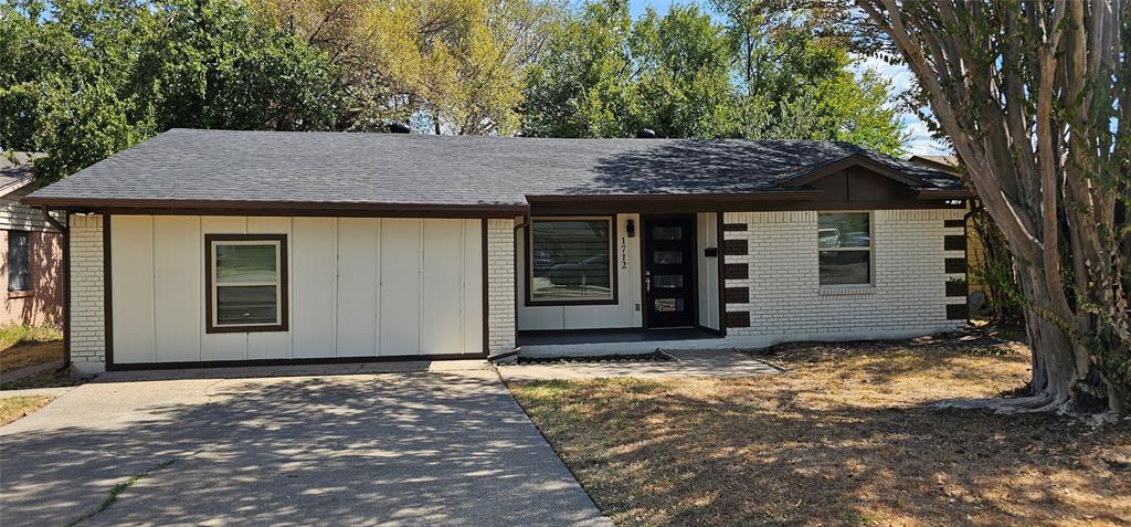 White brick exterior with dark trim accents