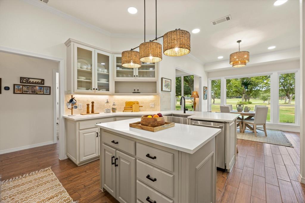 Chef's Updated Kitchen Featuring New Quartz Counter Tops, Backsplash, Designer Paint Colors and Trending Light Fixtures