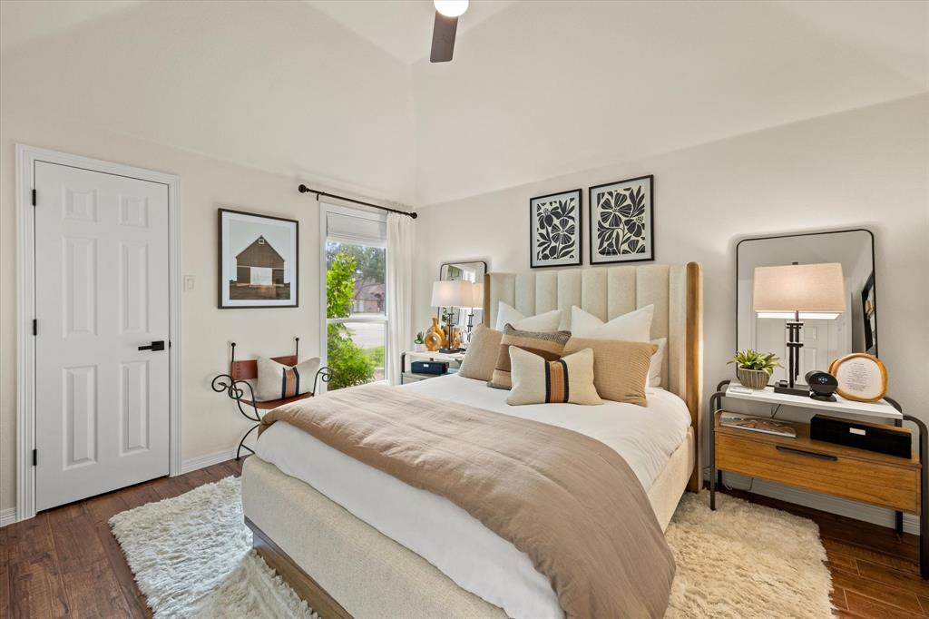 Secondary Bedroom with Walk-In Closet and Elevated Ceiling