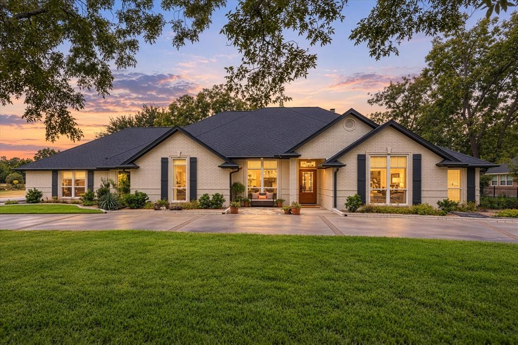 Welcome Home! This Updated Home has it all! Features include New Flagstone Front Patio, Custom Shutters, Front Door, Uplighting, Landscaping and Designer Painted Brick Just to Name a Few.  A Must See!