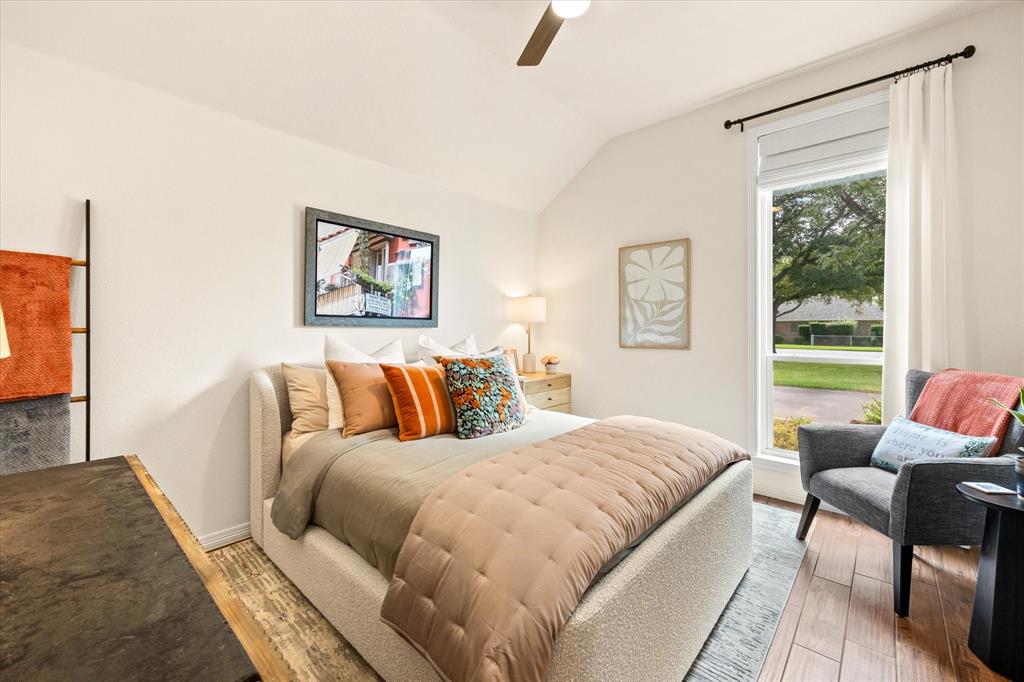Secondary Bedroom with Elevated Ceiling and Walk-In Closet with Built-Ins