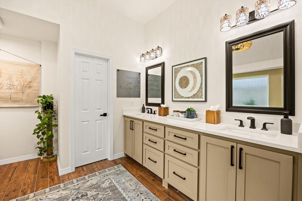 Another View of the Primary Bathroom Leading to the Oversized Closet with Built-In Drawers and Shelving