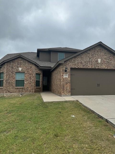 Brick veneer exterior with a brown garage door, dark shingle roof, and a concrete driveway Brick veneer exterior with a brown garage door, dark shingle roof, and a concrete driveway