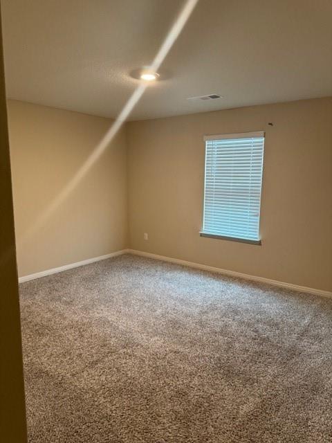 Carpeted flooring, recessed ceiling lighting, light-toned wall paint, white window blinds, and white trim molding Carpeted flooring, recessed ceiling lighting, light-toned wall paint, white window blinds, and white trim molding