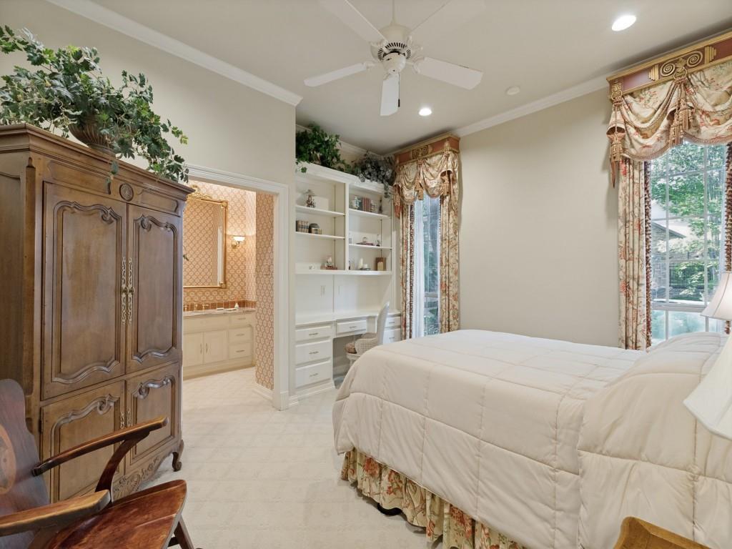 Plush carpet flooring, built-in shelving with desk, recessed lighting, and a ceiling fan