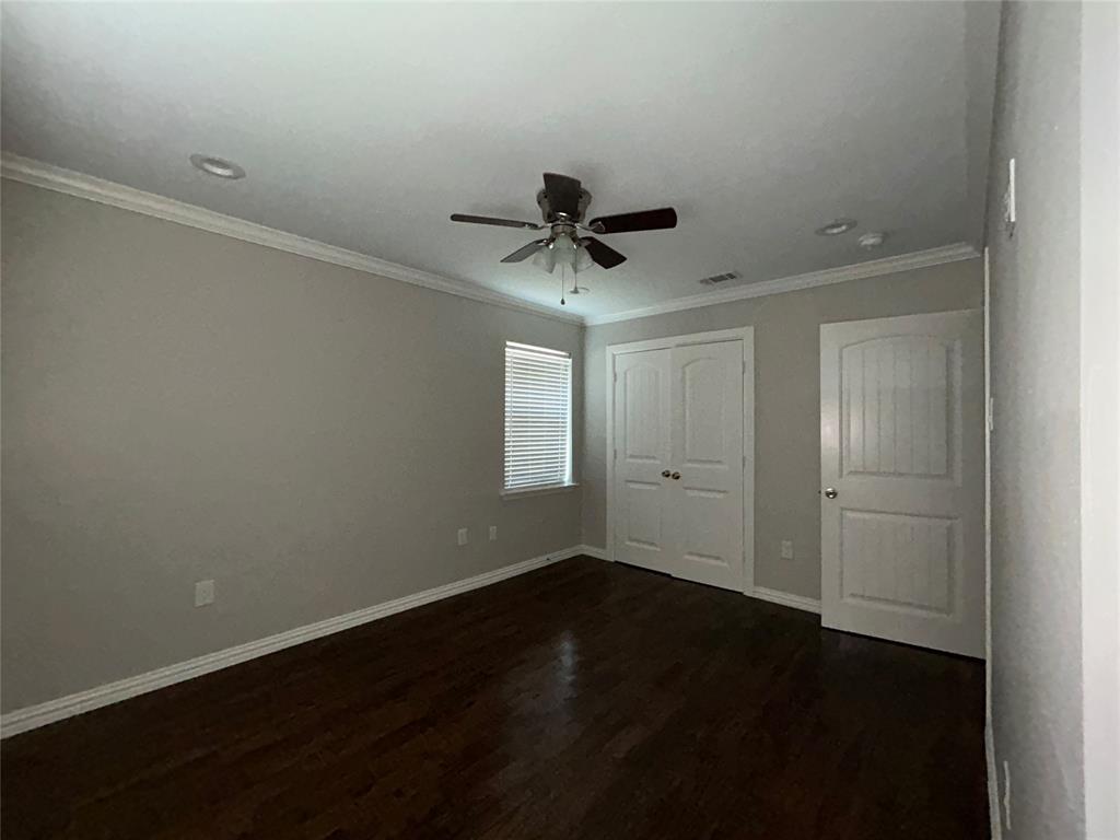 Dark wood-finish flooring, ceiling fan with integrated lighting, recessed lighting, white window blinds, and white trim throughout Dark wood-finish flooring, ceiling fan with integrated lighting, recessed lighting, white window blinds, and white trim throughout