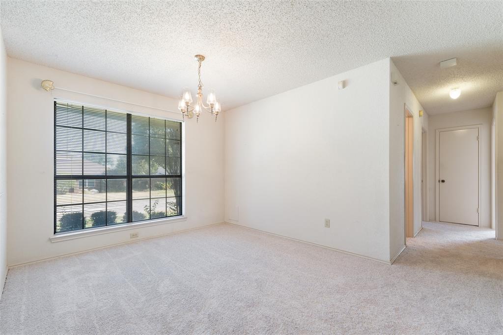 Looking from the dining room to the hallway leading to the bedrooms and baths.