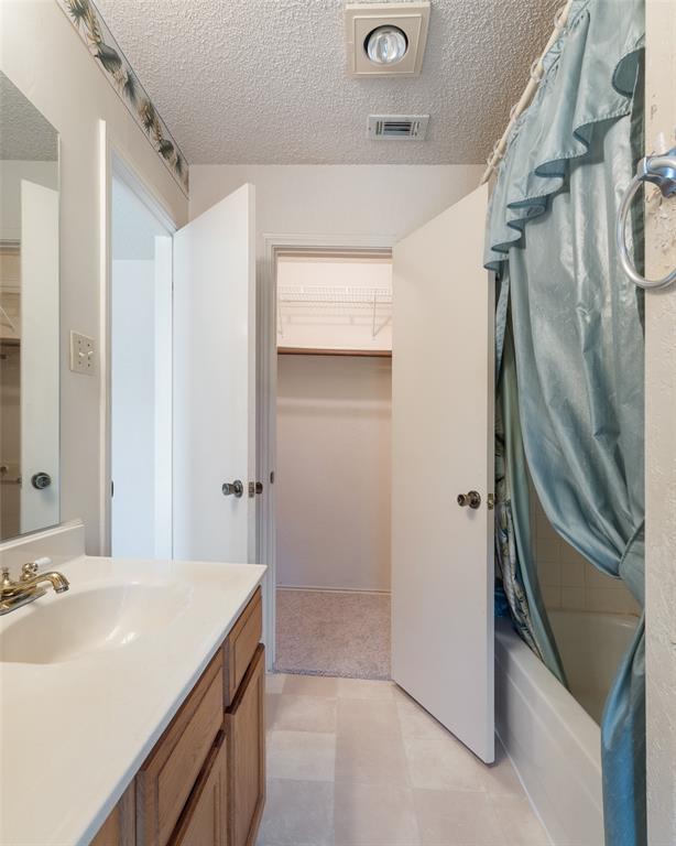 A walk-in closet is at the far end of the owners bathroom.
