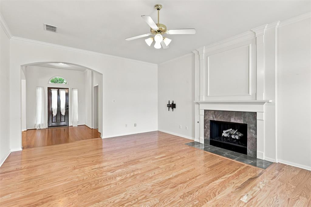 Living Room features engineered hardwood floors and gas fireplace.