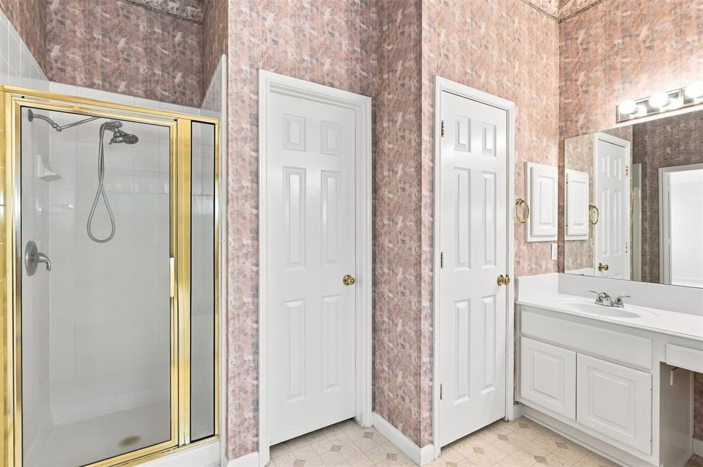 Separate Shower with glass door.