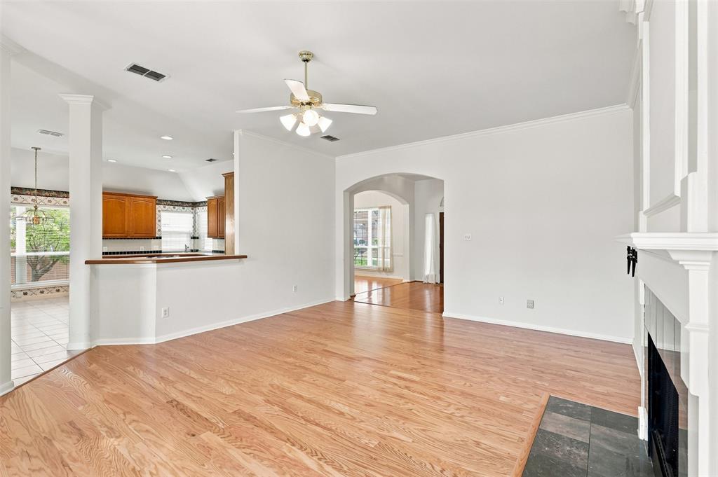Kitchen flows to living area and dining room making the space feel large and airy.