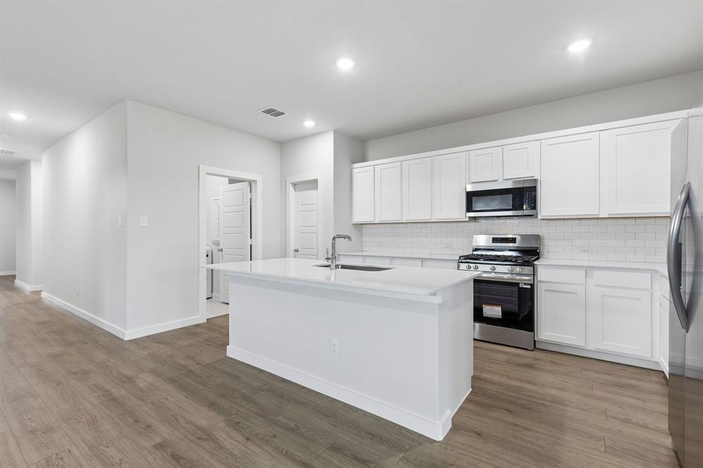 Kitchen in the Oscar home plan by Trophy Signature Homes – REPRESENTATIVE PHOTO Kitchen in the Oscar home plan by Trophy Signature Homes – REPRESENTATIVE PHOTO