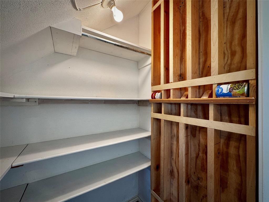 Additional pantry space under the stairs... don't miss this fun canned storage wall!