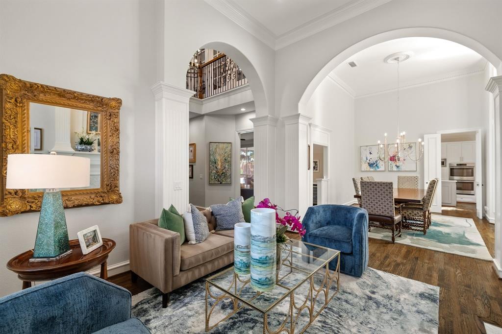Beautiful living room flows seamlessly into the formal dining room.