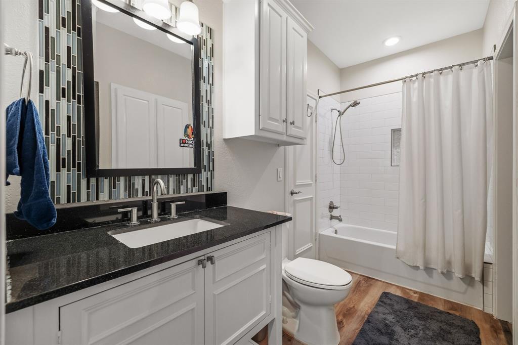 Updated full bathroom with access to secondary bedroom & media room.