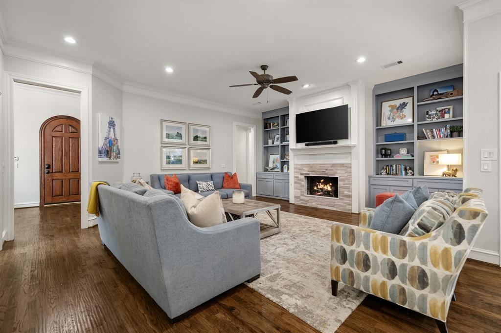 Hardwood flooring, recessed lighting, ceiling fan, custom cabinetry