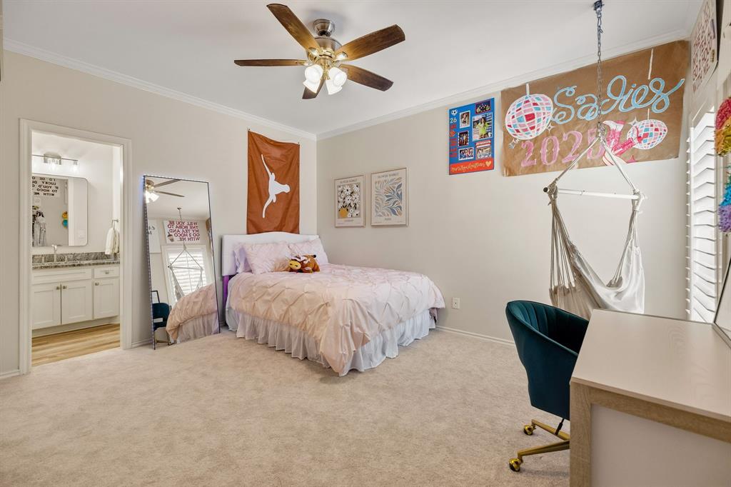 Secondary bedroom with custom closet system & access to Jack & Jill bathroom.