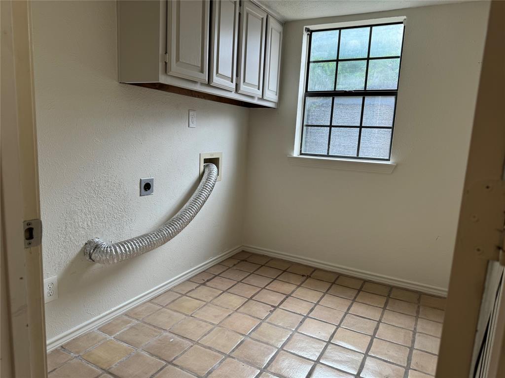 large utility room with cabinets