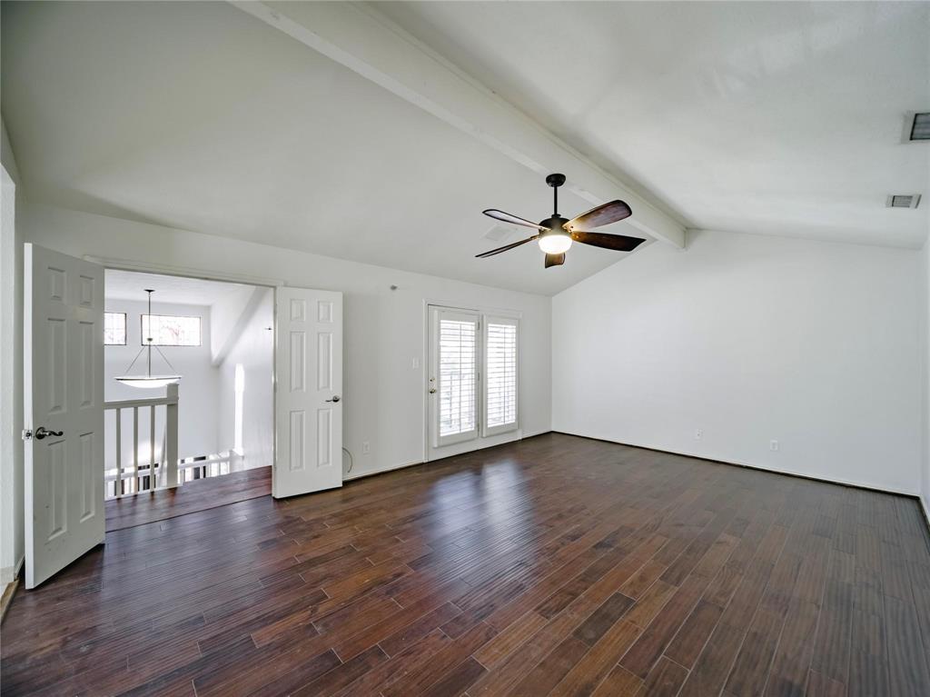 Upstairs primary suite with private access to covered balcony