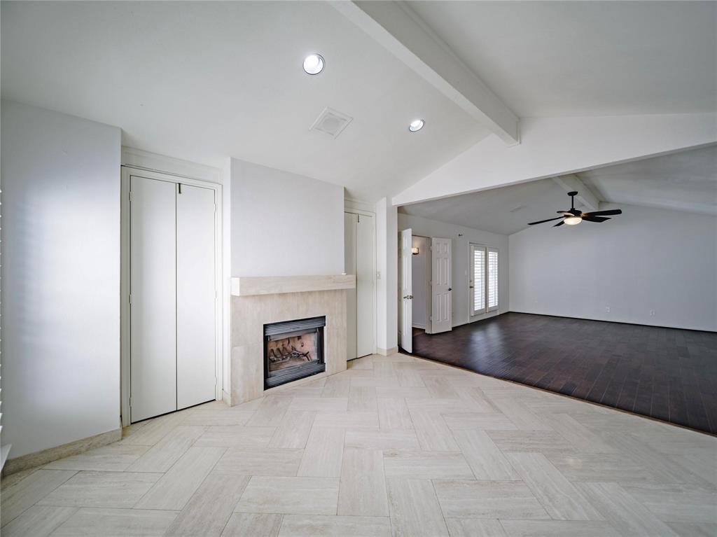 Upstairs primary suite with fireplace