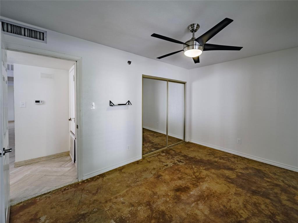 downstairs guest bathroom with stained concrete flooring