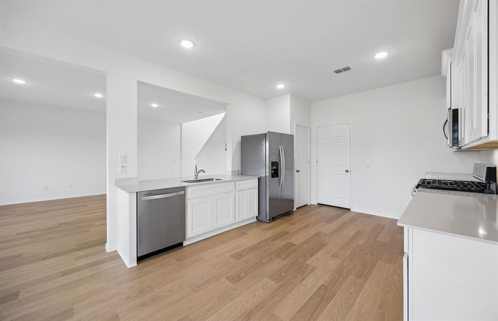 *Floorplan representation, not actual home -  Large eat-in bar overlooking gathering room and dining areas