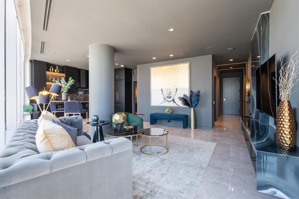 Recessed lighting throughout, expansive window line, sleek built-in cabinetry, and tile flooring Recessed lighting throughout, expansive window line, sleek built-in cabinetry, and tile flooring