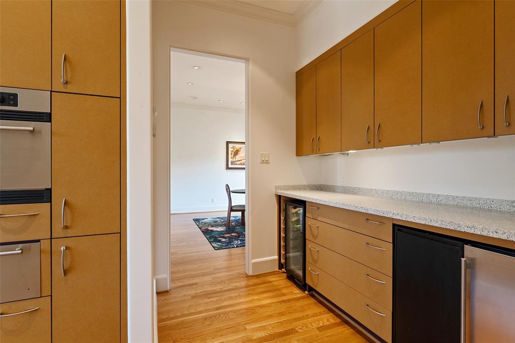 Butler's pantry with wine cooler and ice maker