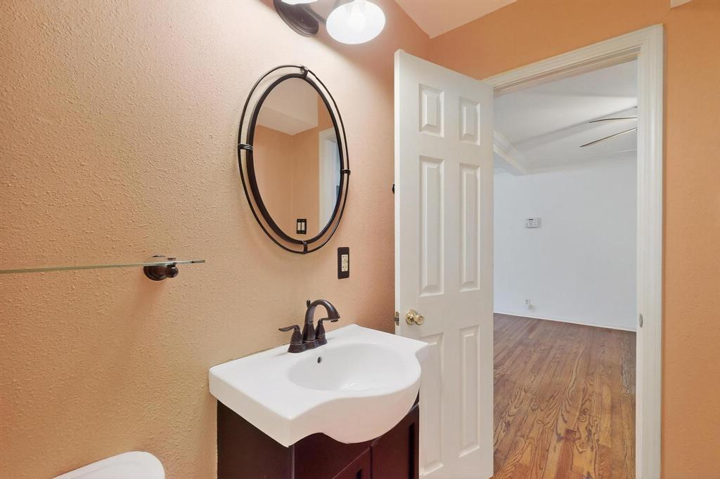 Bathroom with vanity and wood finished floors