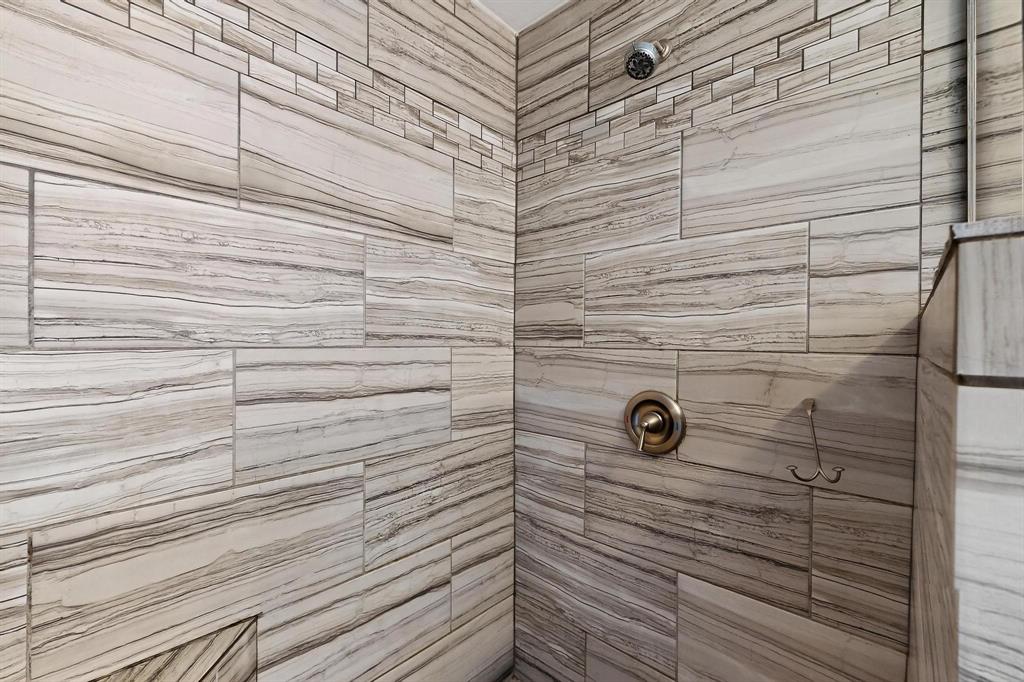 Bathroom with a tile shower