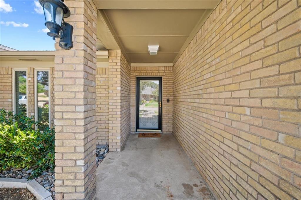 Close up view of front door with covered area Close up view of front door with covered area
