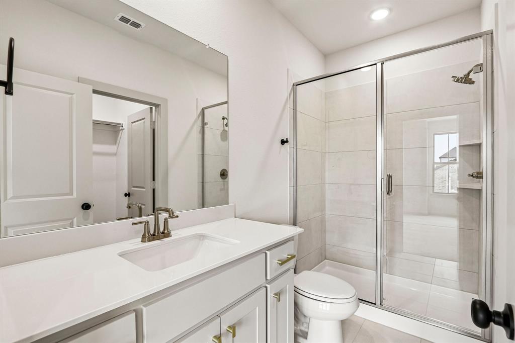 Friends and family will feel right at home in any of the beautifully finished guest baths.