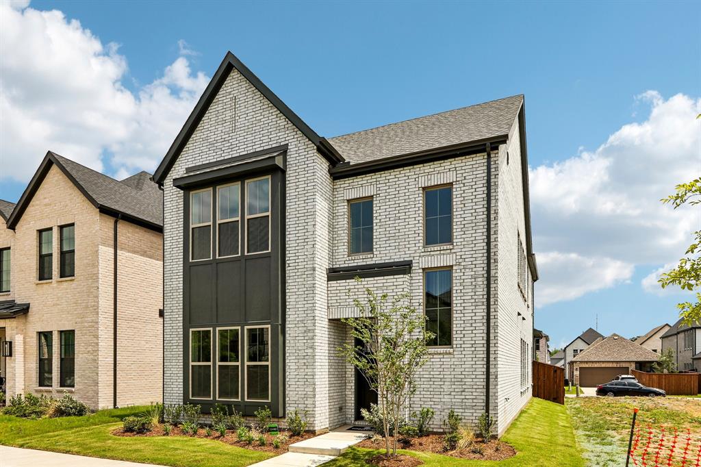 Featuring beautiful white brick with striking dark trim, this dream home offers outstanding curb appeal!