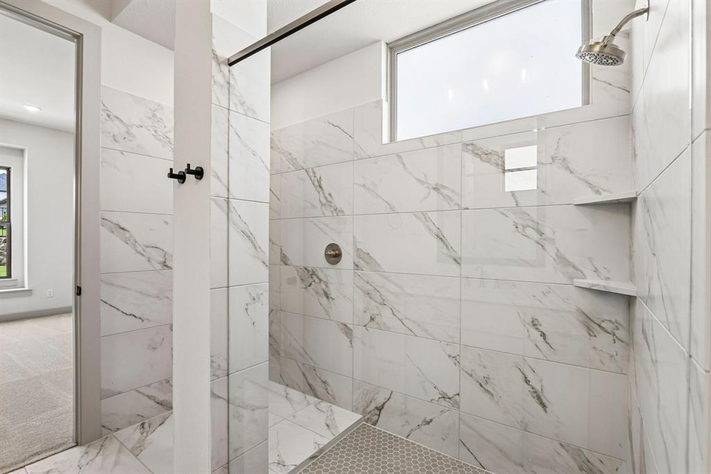You will never want to leave this spacious walk in shower in your new owner's bath!