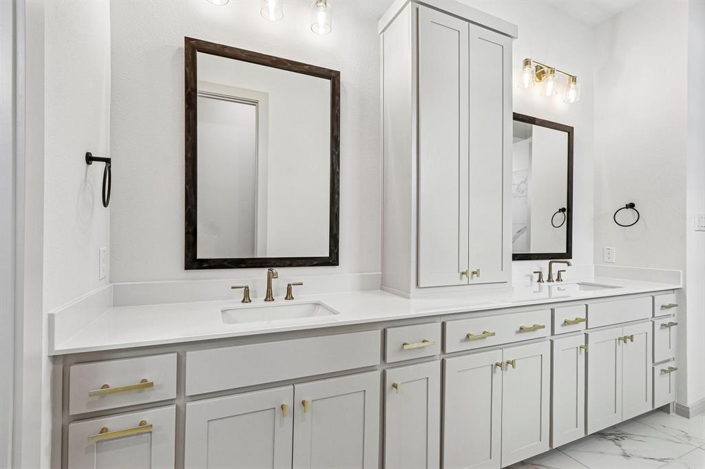Your thoughtfully designed owner's bath offers ample room for two!