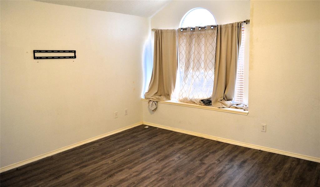 Vaulted ceiling with wood-finish flooring