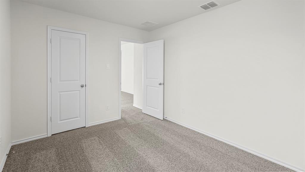 Room featuring light gray carpet flooring and white painted walls