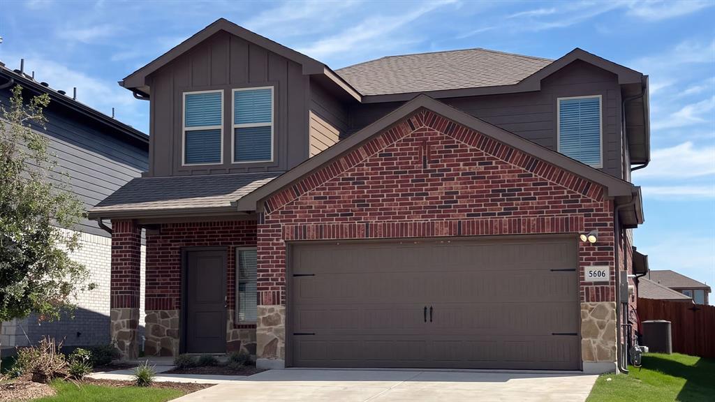 Brick and stone facade with board-and-batten siding Brick and stone facade with board-and-batten siding