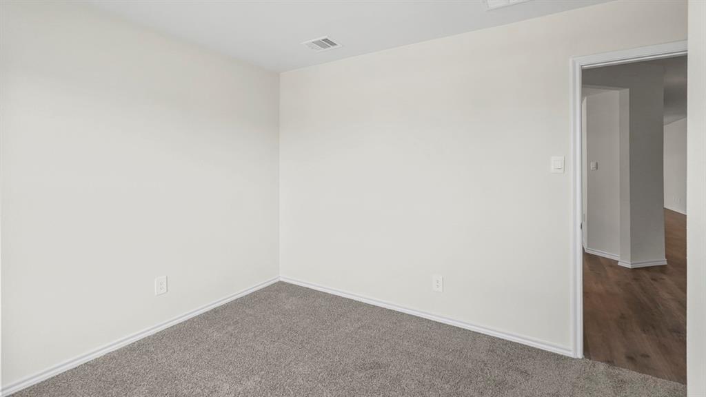 Neutral wall paint, plush carpeting, wood-finish flooring in adjacent space Neutral wall paint, plush carpeting, wood-finish flooring in adjacent space