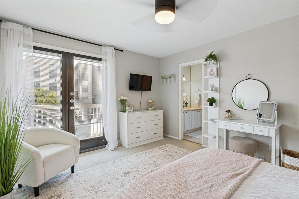 Hardwood-finish flooring, ceiling fan with integrated lighting, and a glass-paneled exterior door