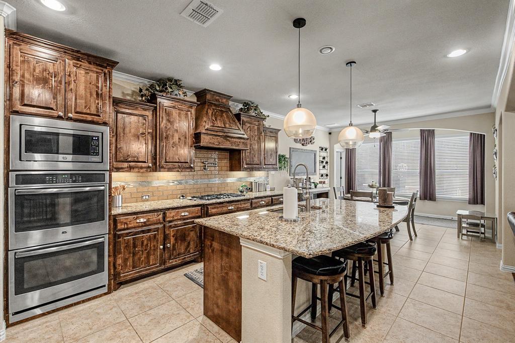 Eat-in Kitchen with Island, double ovens, gas cooktop and lots of storage!