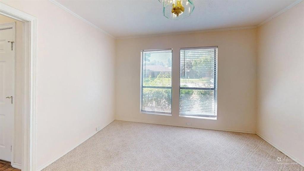 Recessed lighting fixture, carpeting, and two large windows with blinds
