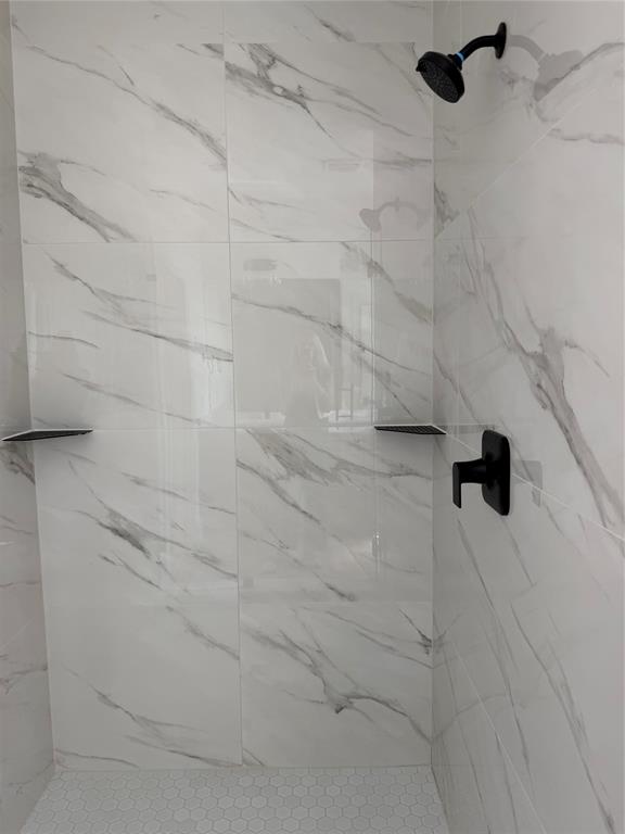 Beautiful Tiled Shower in Primary