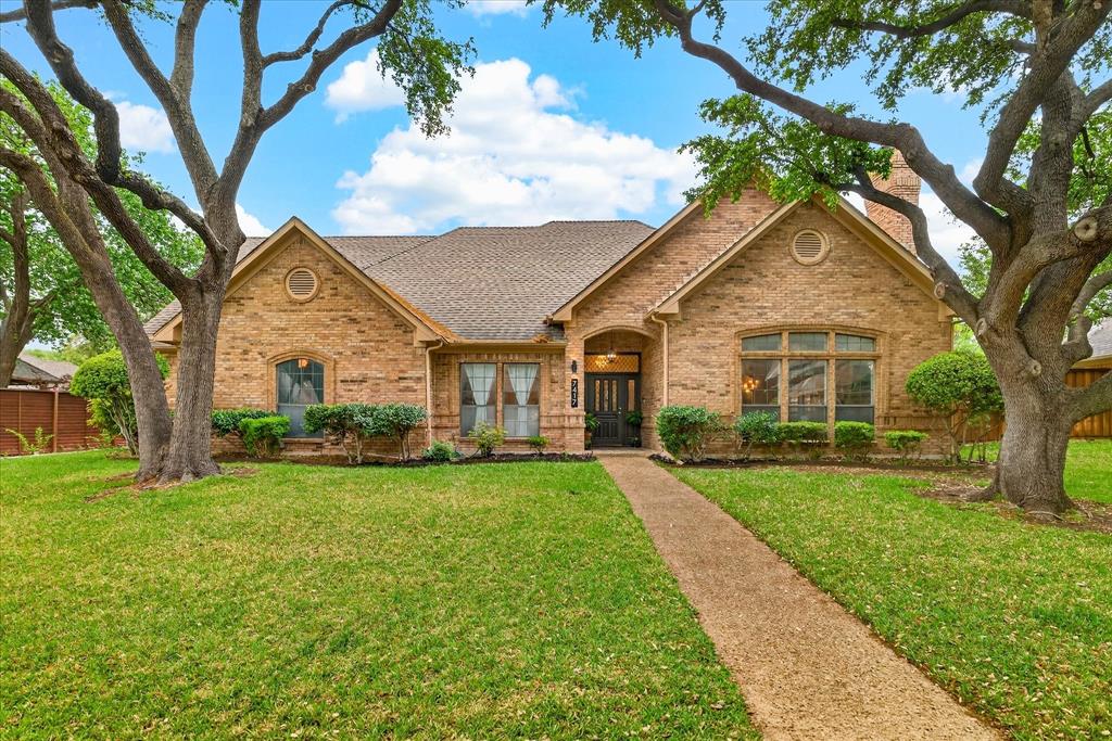 Brick exterior with a gabled roof and arched entryway Brick exterior with a gabled roof and arched entryway