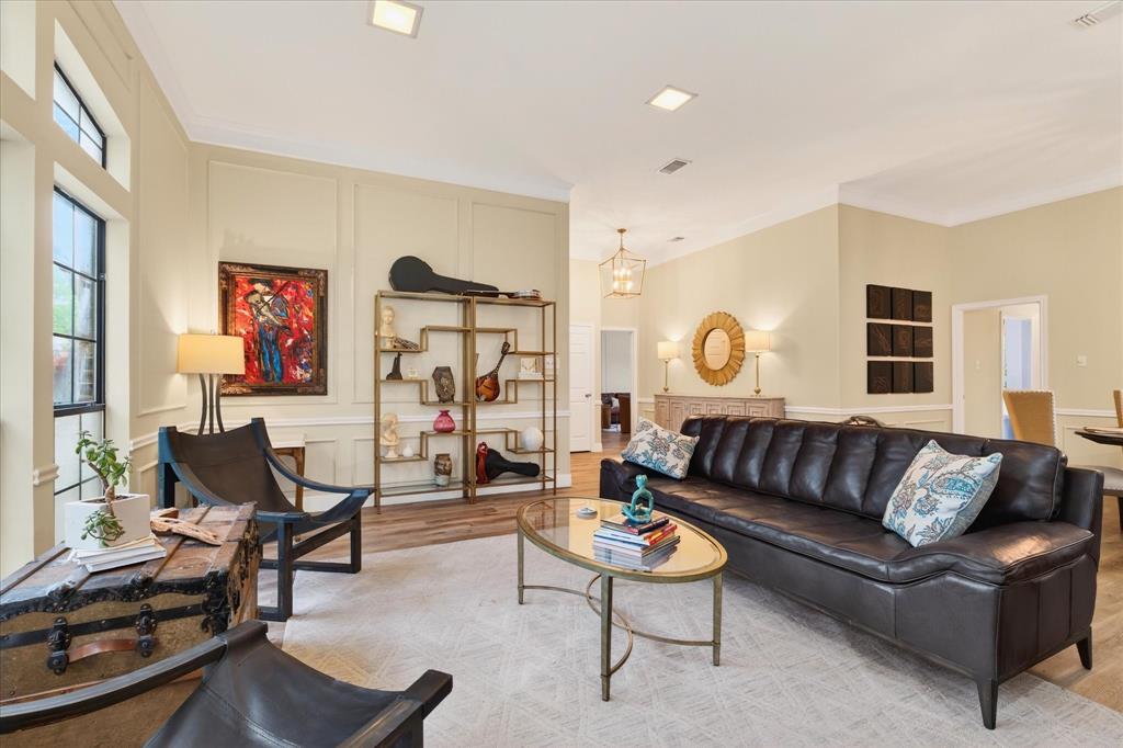 Recessed lighting, wood-finish flooring, and crown molding