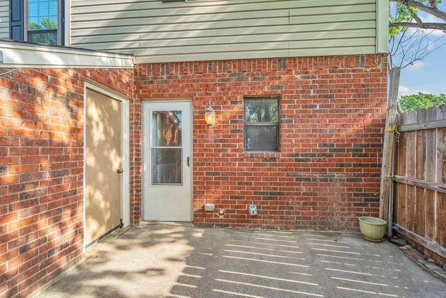 Brick exterior walls with a concrete patio Brick exterior walls with a concrete patio